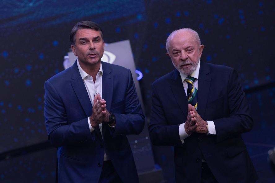 Flávio Bolsonaro (PL) e Lula (PT) durante debate da Band