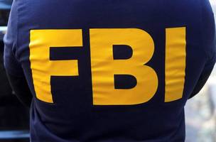 Agente do FBI19/10/2021REUTERS/Carlo Allegri (Foto: Divulgação / InfoMoney)